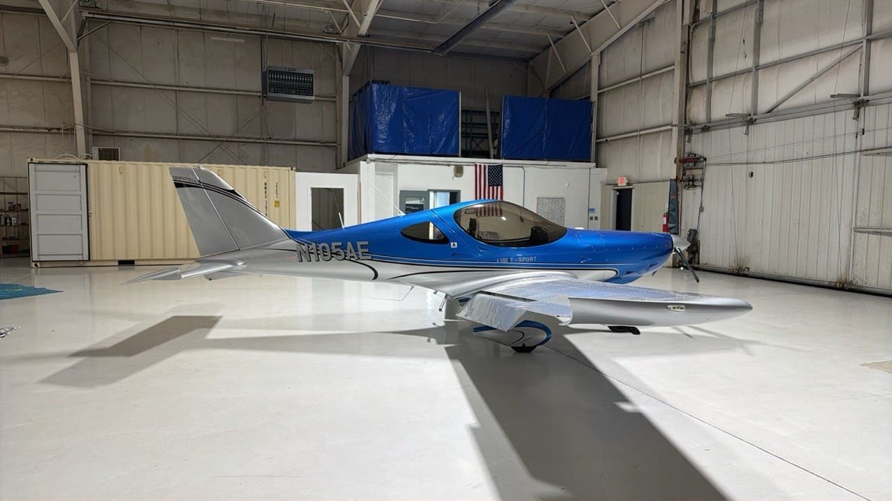 The blue and silver Bristell N105AE inside the hangar