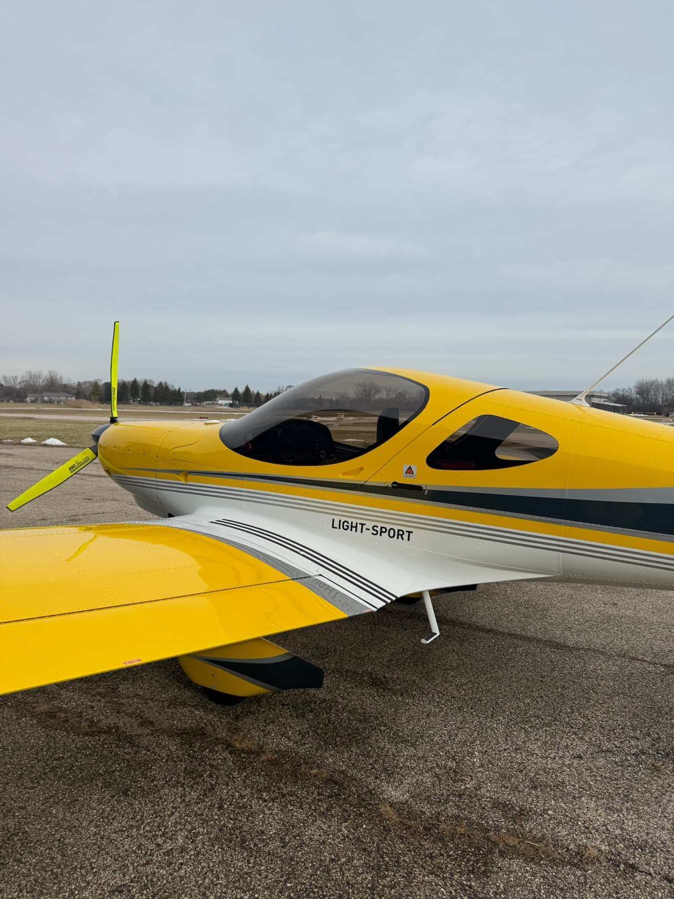 Nose and propeller of a yellow Bristell close up