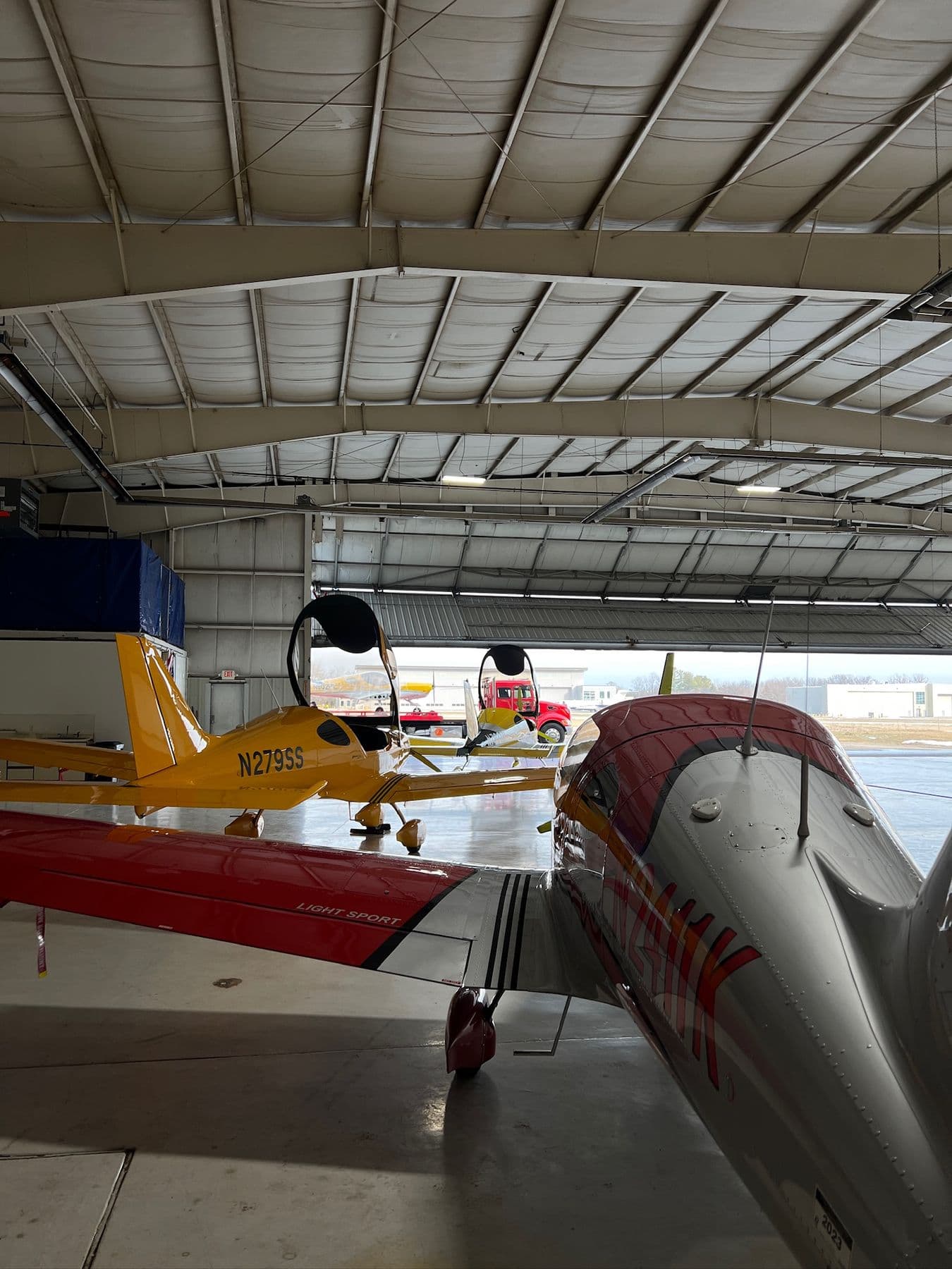 Two aircraft inside the Golden Wings hangar
