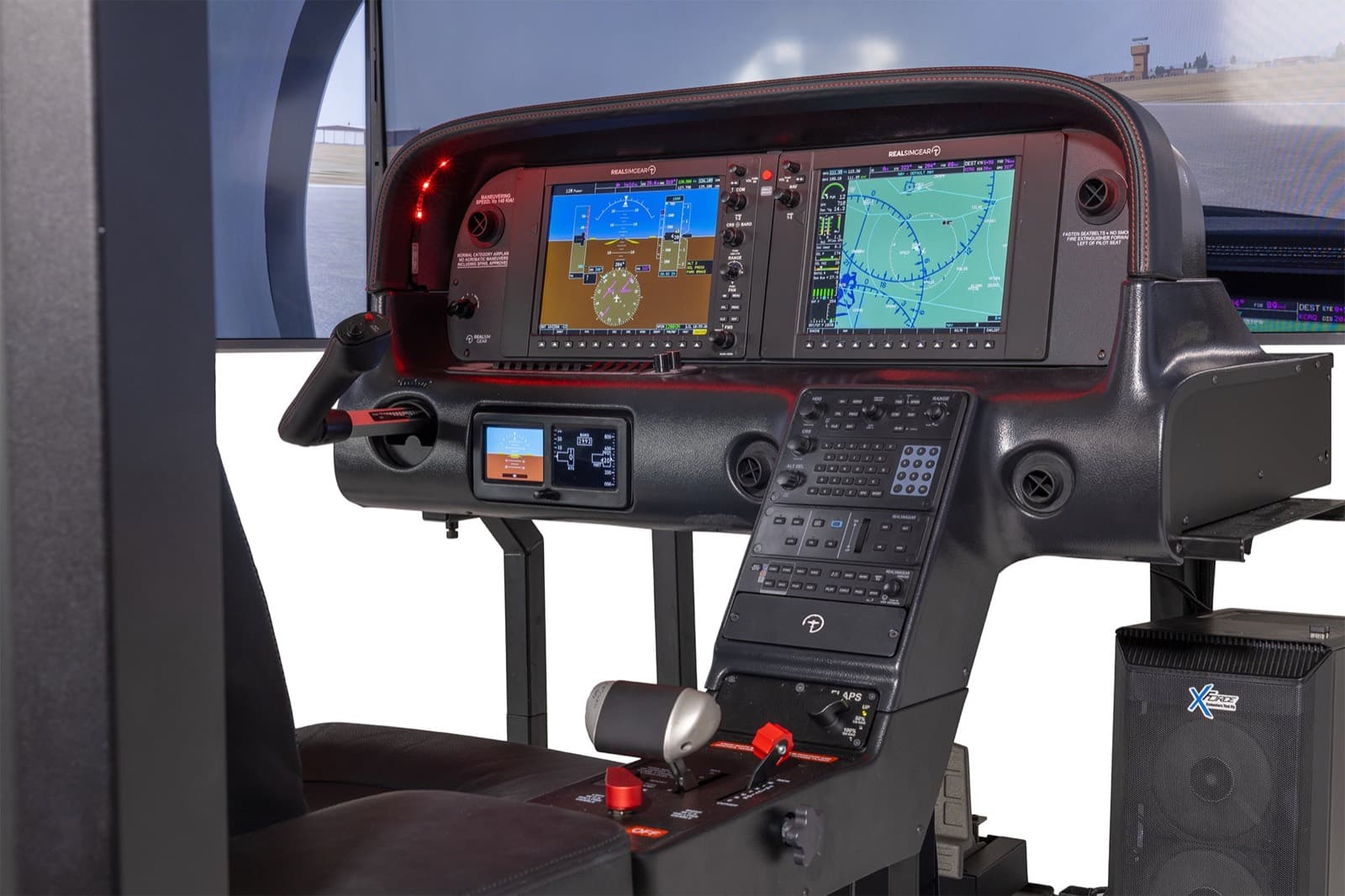 The SRx flight deck with the wraparound visuals lit behind it